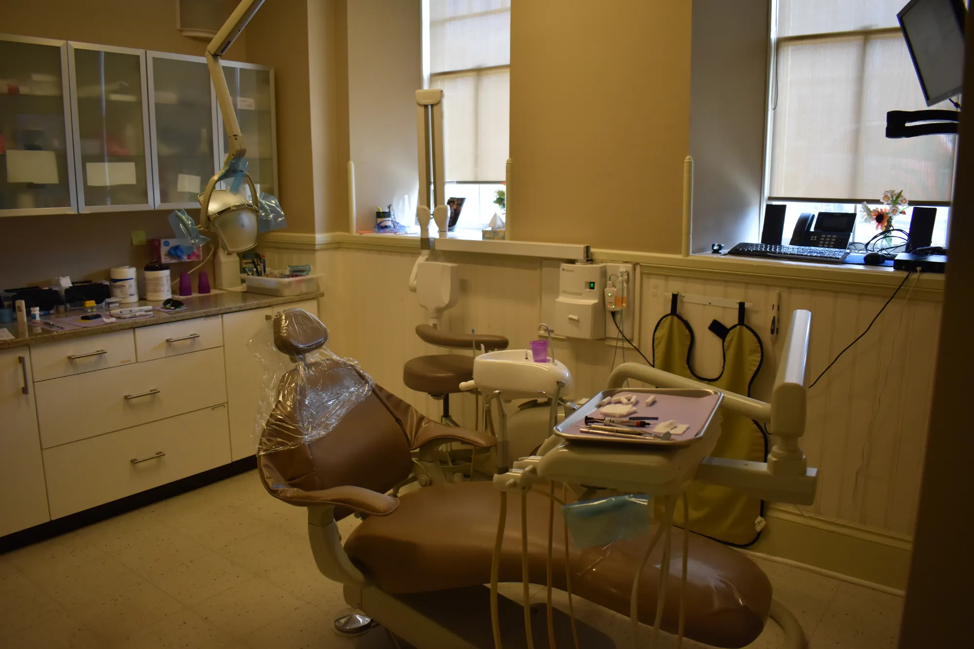 Dental treatment room with a patient chair and equipment